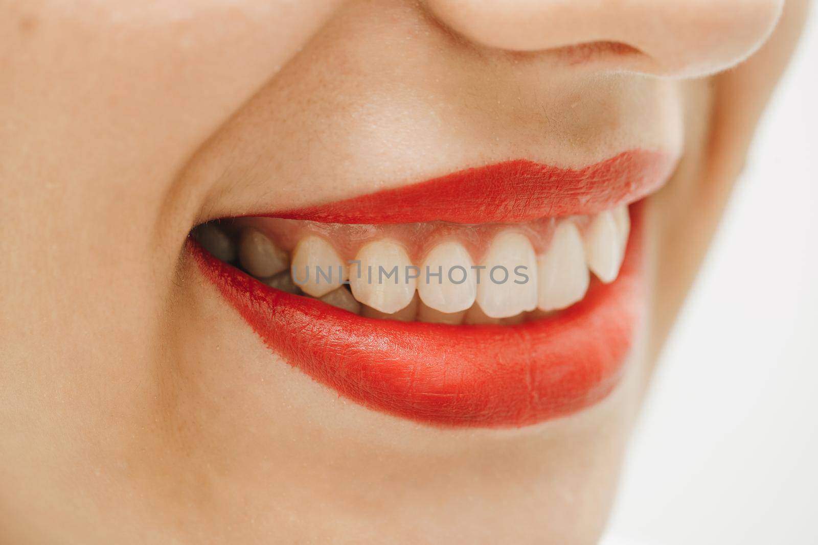 Close-up of a beautiful woman smile. Woman smiling with prefect white teeth by uflypro