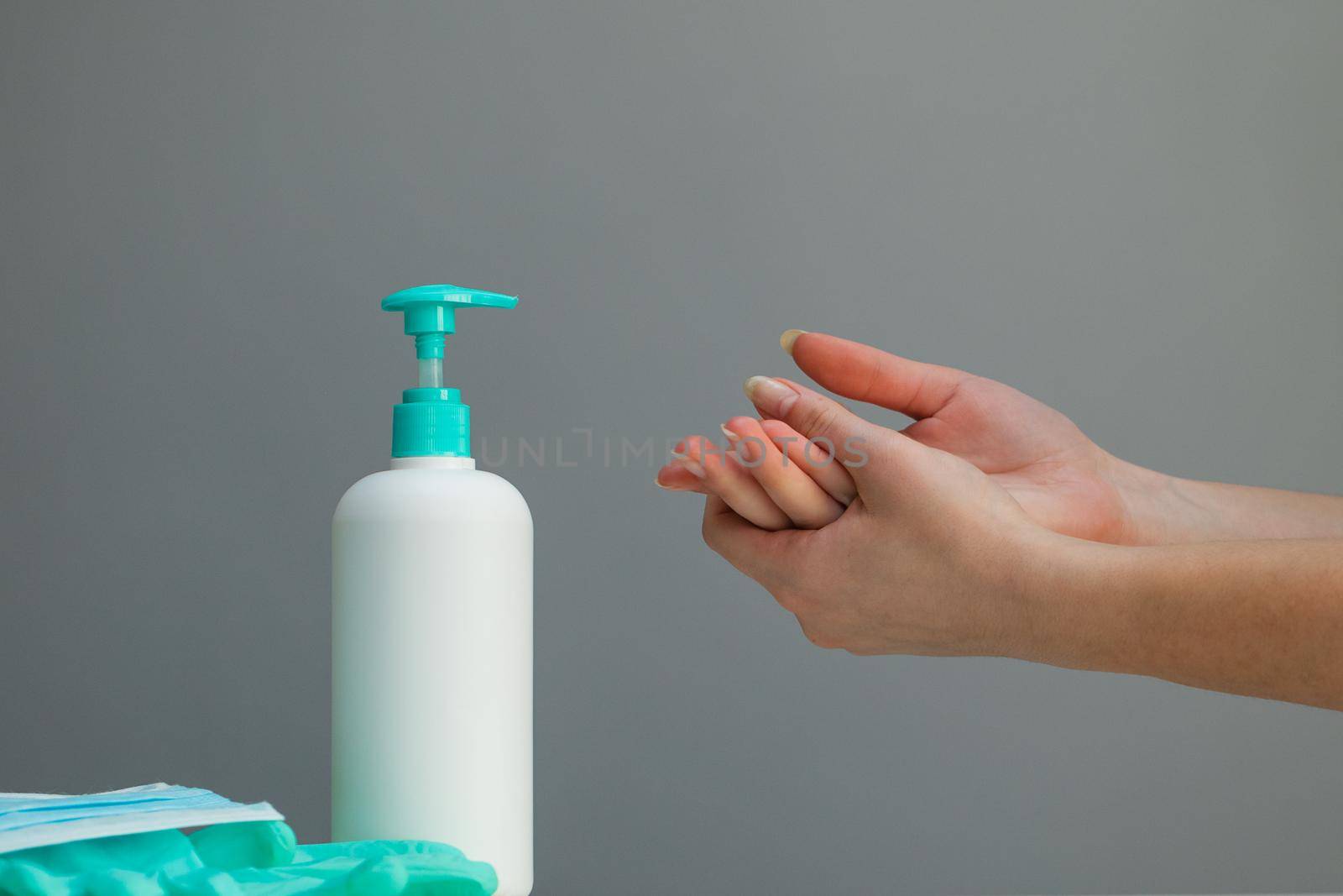 Woman washing hands with alcohol gel or antibacterial soap sanitizer. Hygiene concept. Prevent the spread of germs and bacteria and avoid infections corona virus. by uflypro
