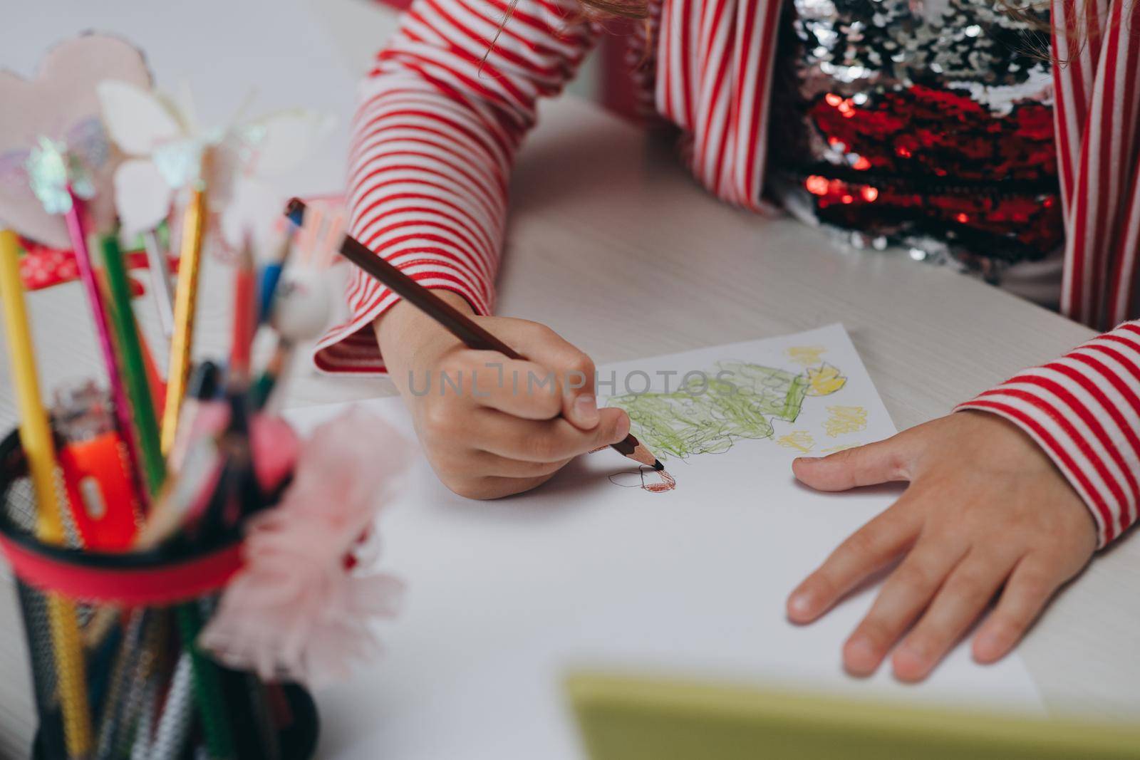 Hands of kid who is involved by drawing. Creative hobby, lifestyle drawing. Artist concept. Talented Innovative Female Artist Draws with Her Hands.