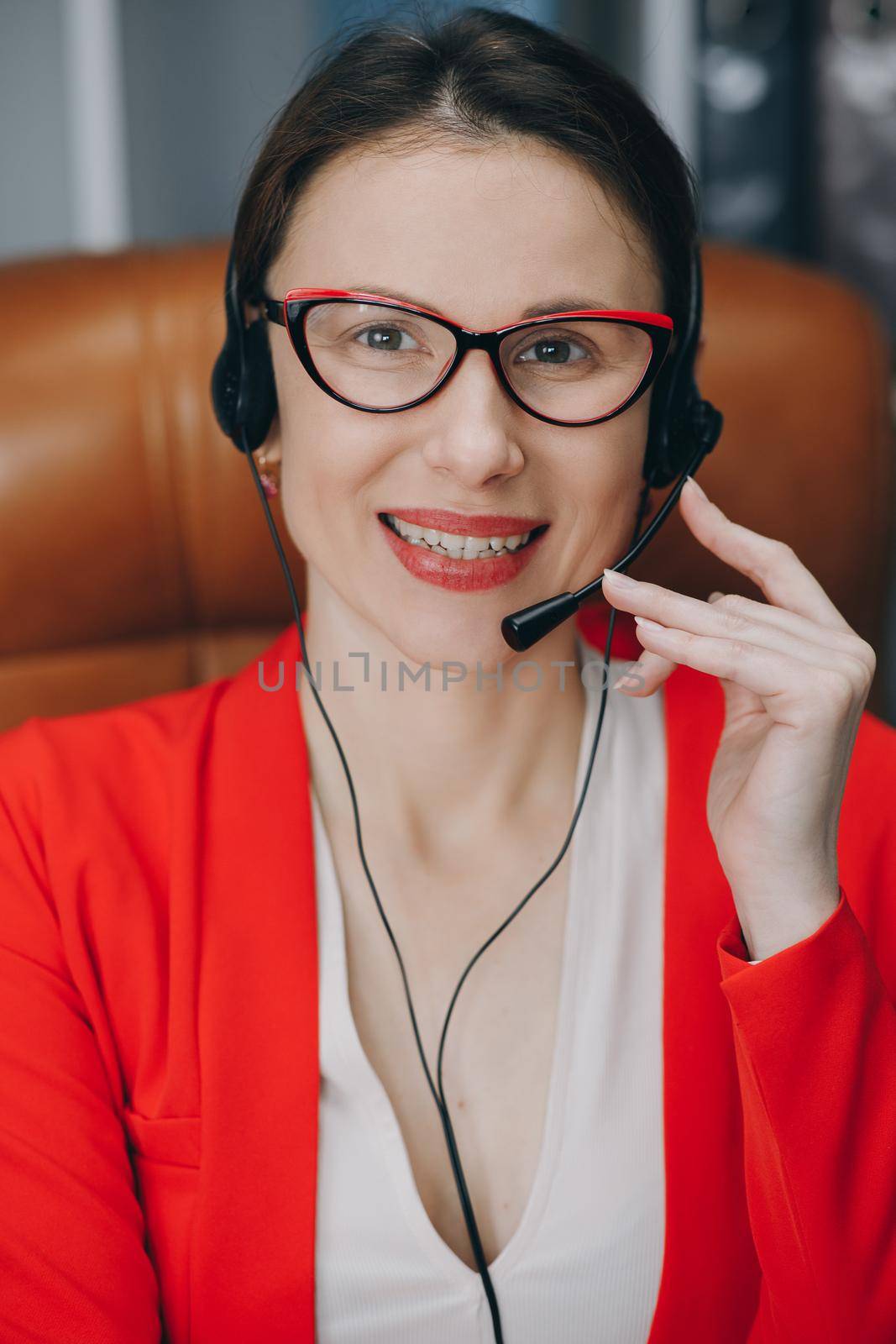 Happy woman in headphones speaking by webcam at webinar training look at laptop make notes, girl student talking by video conference call, online teacher teaching consulting client e-coaching concept