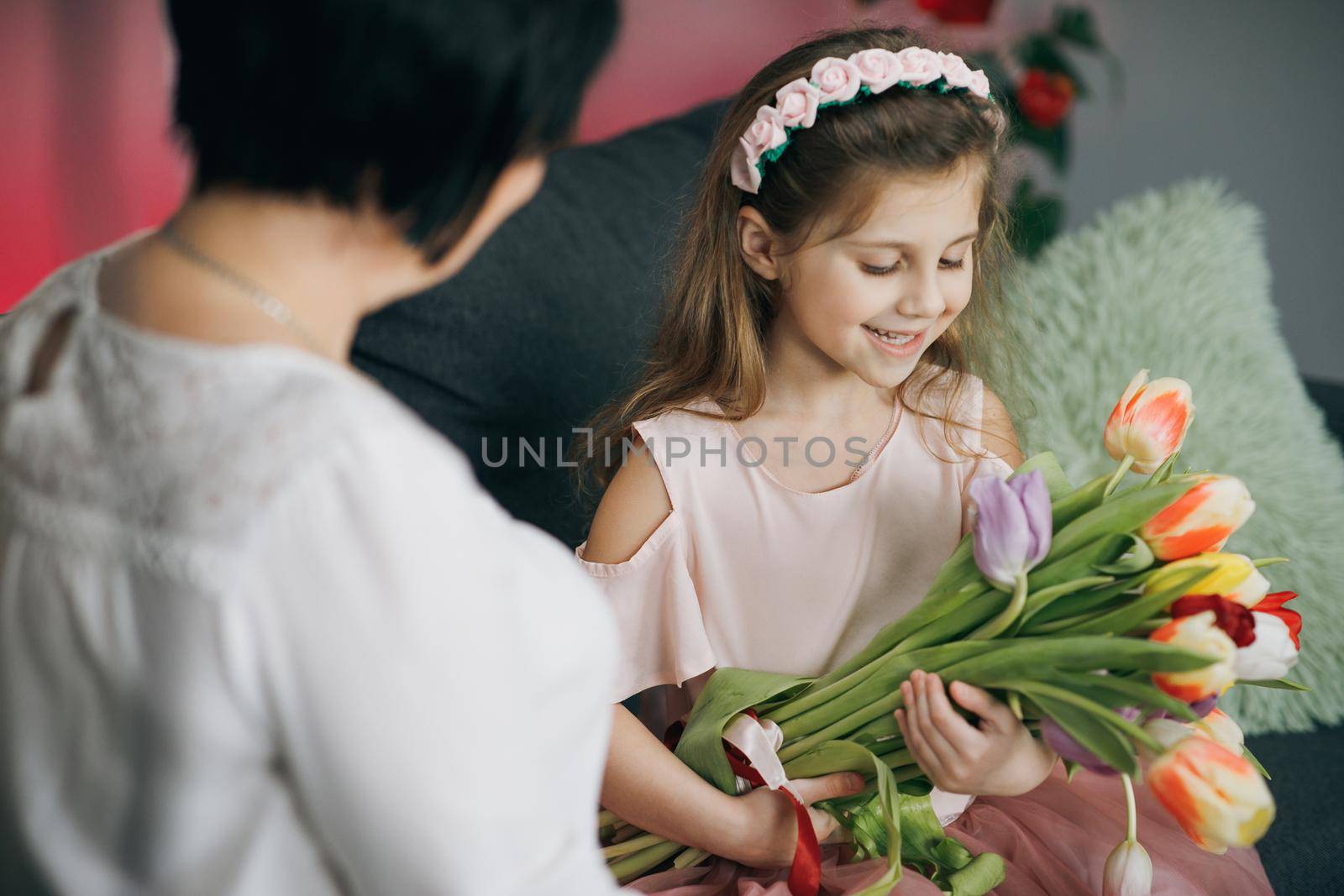 Happy Mother's Day Joy. Kissing and hugging happy family. Beautiful Mother And her little daughter. Smiling Caucasian Senior Mother with her Adult Daughter Hugging and Kisses in Mother's Day by uflypro