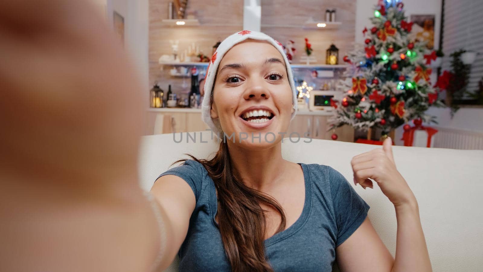 POV of festive woman using video call communication by DCStudio