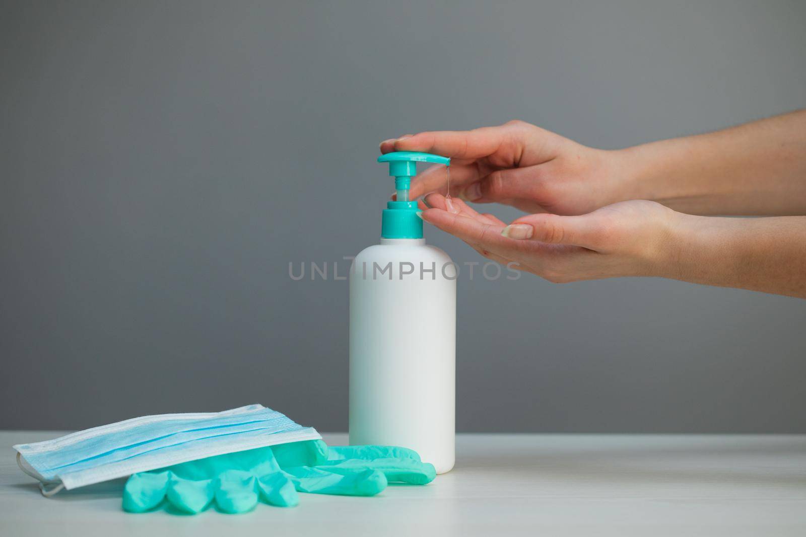 Woman using hand sanitizer gel to prevent spreading virus corona virus covid-19 sars-cov-2 or bacteria. Coronavirus Hand Sanitizer Sanitiser Gel for Clean Hands Hygiene Corona Virus Spread Prevention.