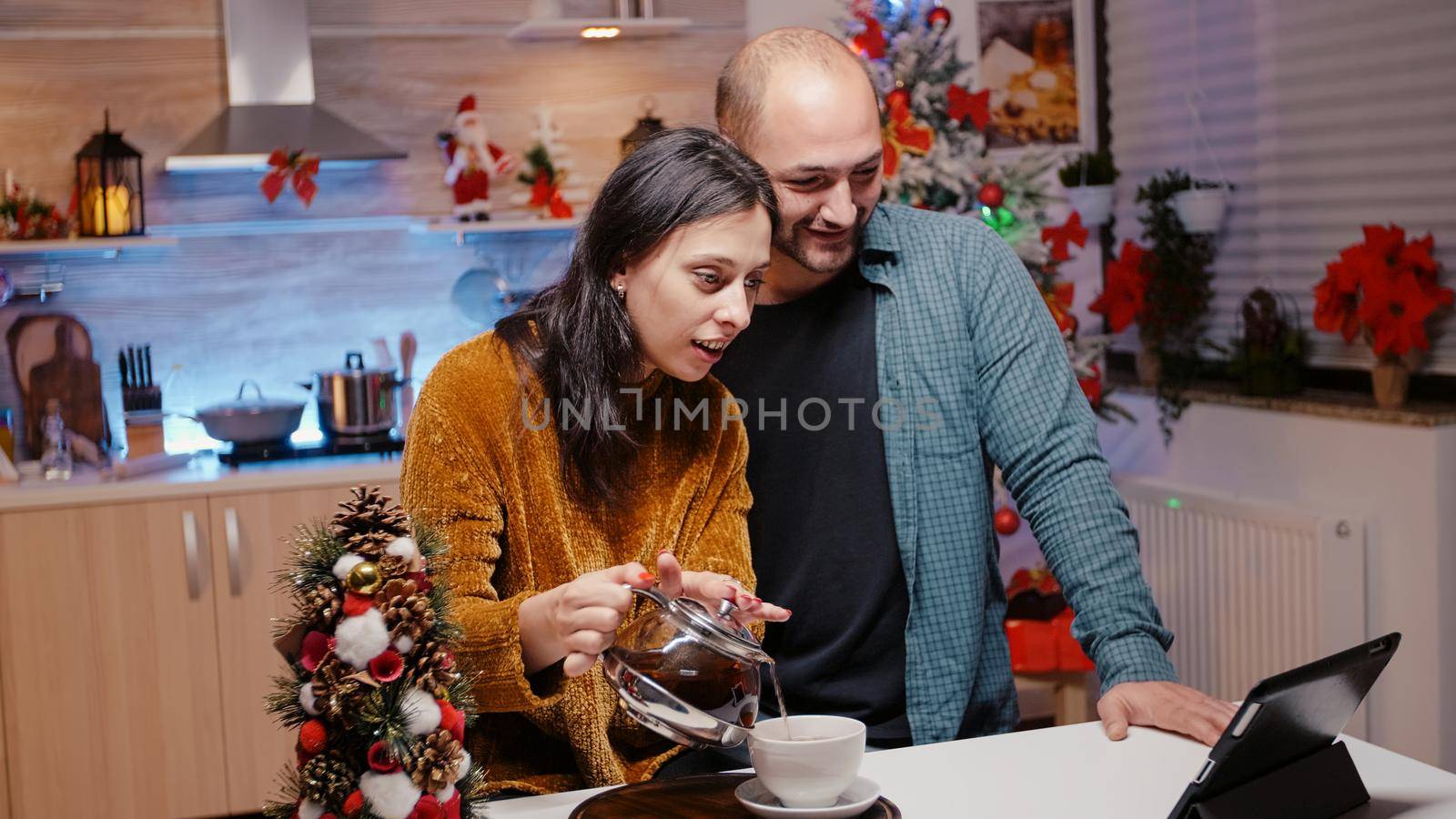 Couple using tablet for video call communication by DCStudio