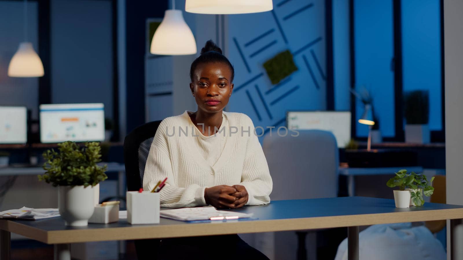 Black manager woman listening partner during video conference by DCStudio