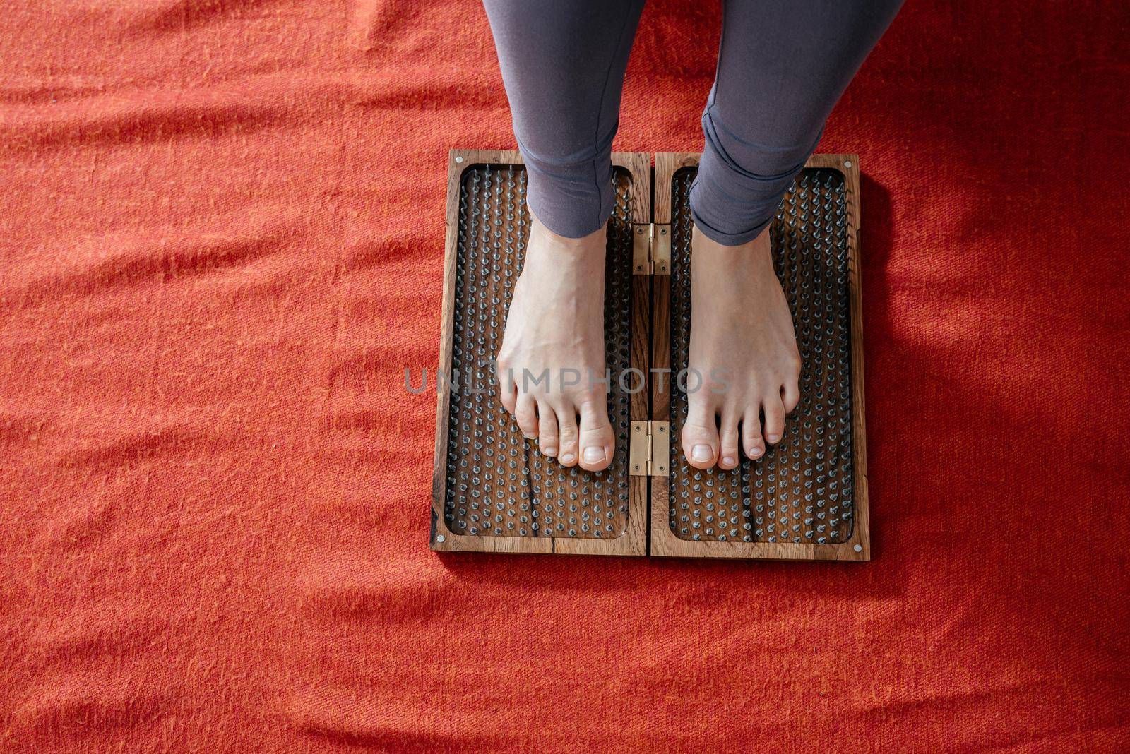 Sadhu board with sharp metal nails. Yoga and health concept by Mariakray