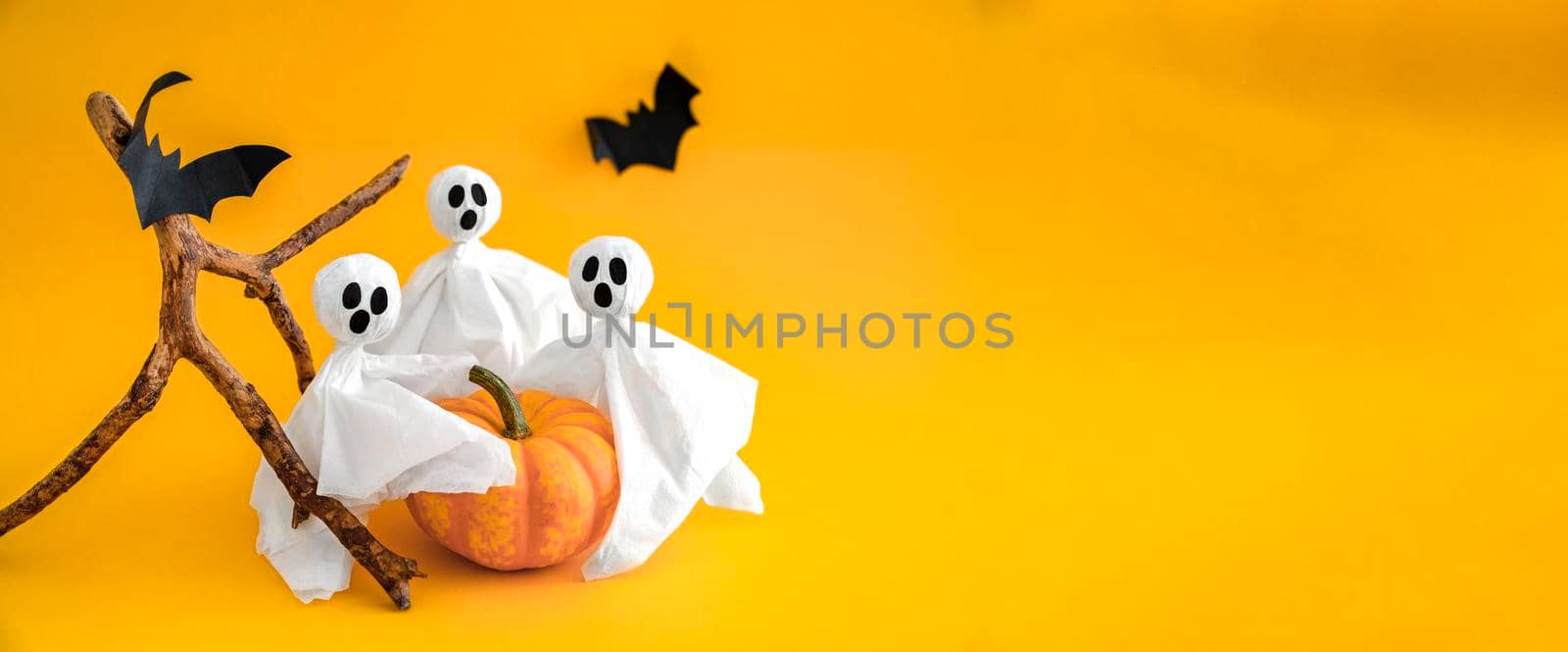 Pumpkin, gosts, bats on orange background, concept of Halloween. Banner. by Laguna781