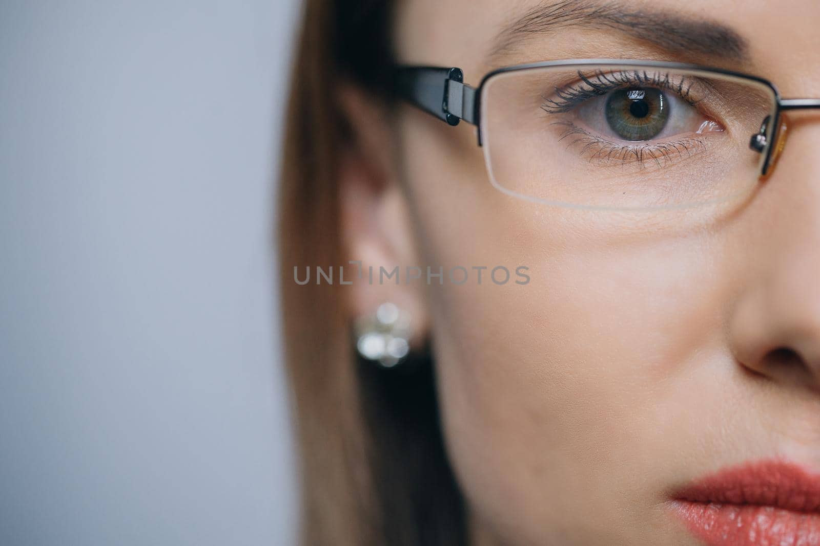 Glasses eyewear closeup of woman in eye glasses. Beautiful young mixed race Caucasian Asian Chinese woman wearing glasses.