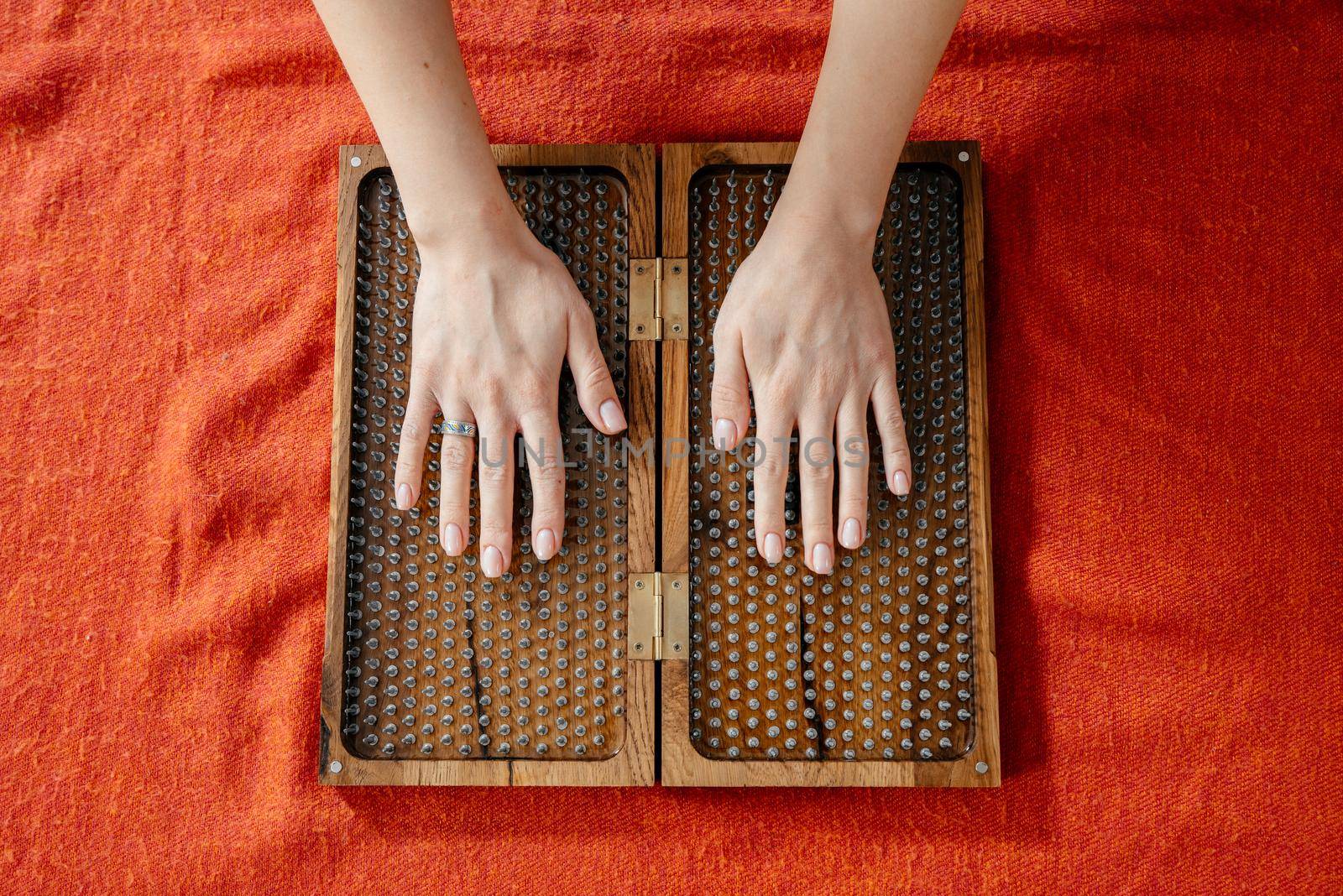 Sadhu board with sharp metal nails. Yoga and health concept by Mariakray