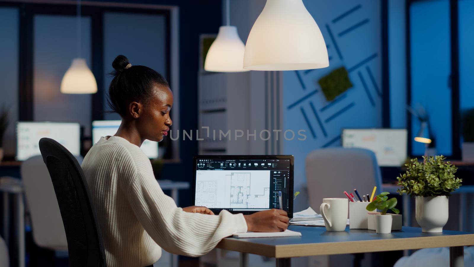 Engineer constructor designer architect creating new bluilding plan in CAD program working in business office. Industrial woman employee studying prototype idea showing cad software on device display