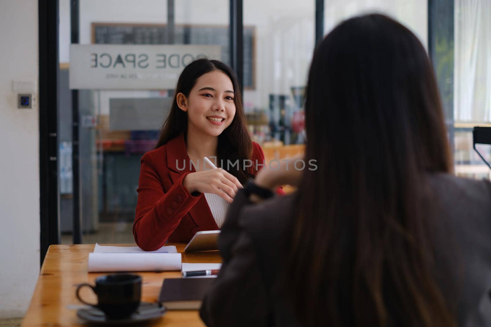 During a job interview, Woman in a suit and gives a presentation about herself