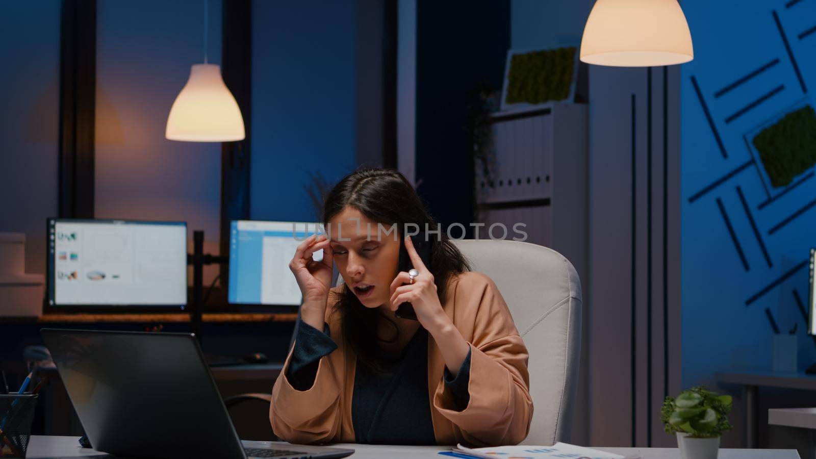 Entrepreneur stressed woman analysing marketing strategy on laptop talking with company manager screaming negative report in startup office. Businesswoman checking commerce statistics