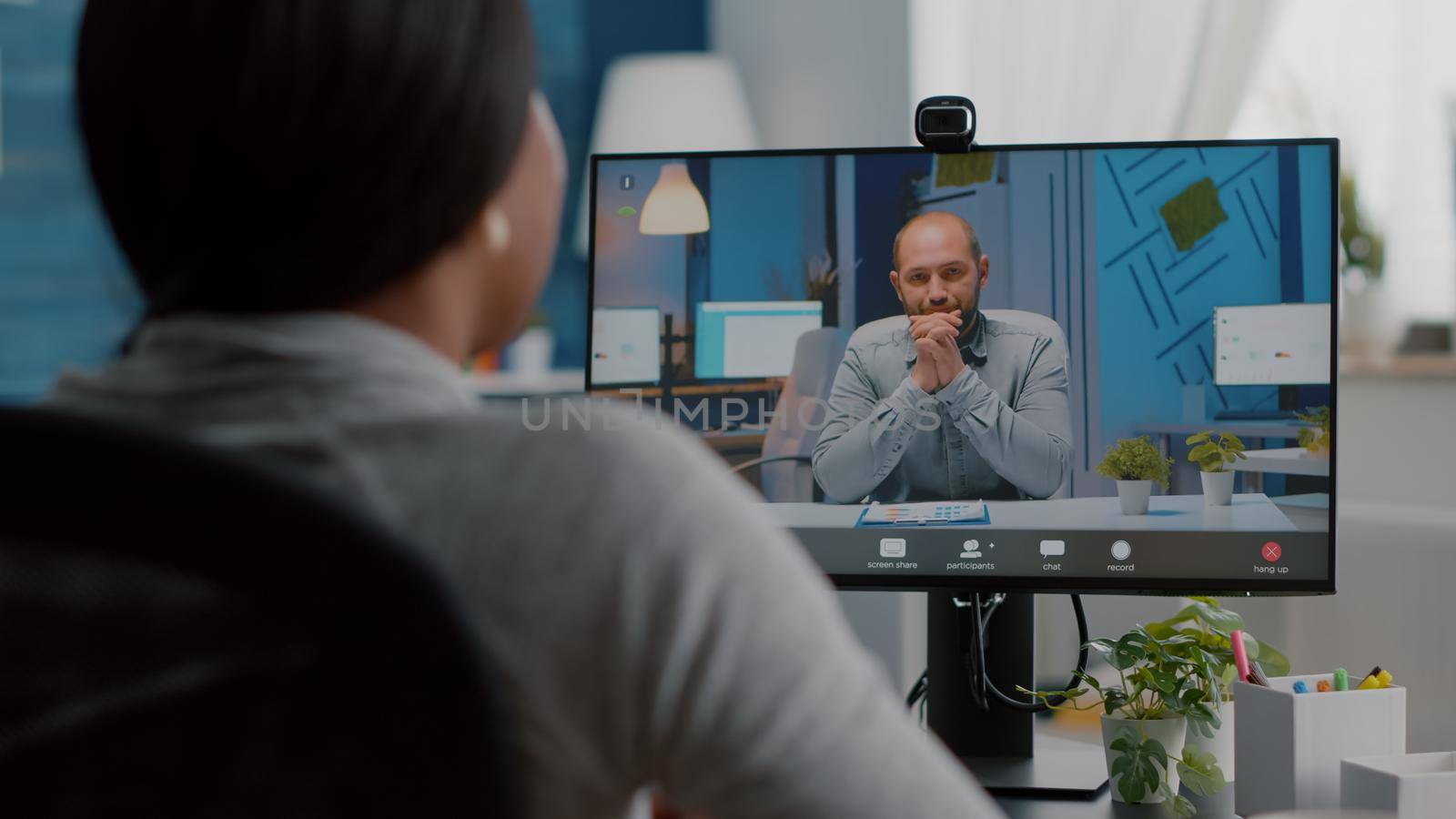 African american woman discussing communication univeristy project explaining marketing ideas during online videocall conference meeting teleconference. Computer user student working remote from home