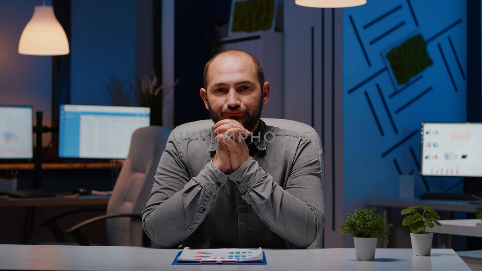 Pov of exhausted businessman discussing with remotely colleague working at financial digital project deadline during videocall conference meeting. Tired entrepreneur working in startup company office