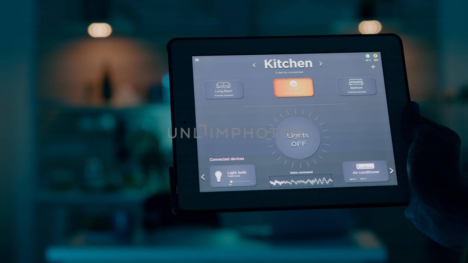 Close up shot of tablet with active smart home application holded by man by DCStudio