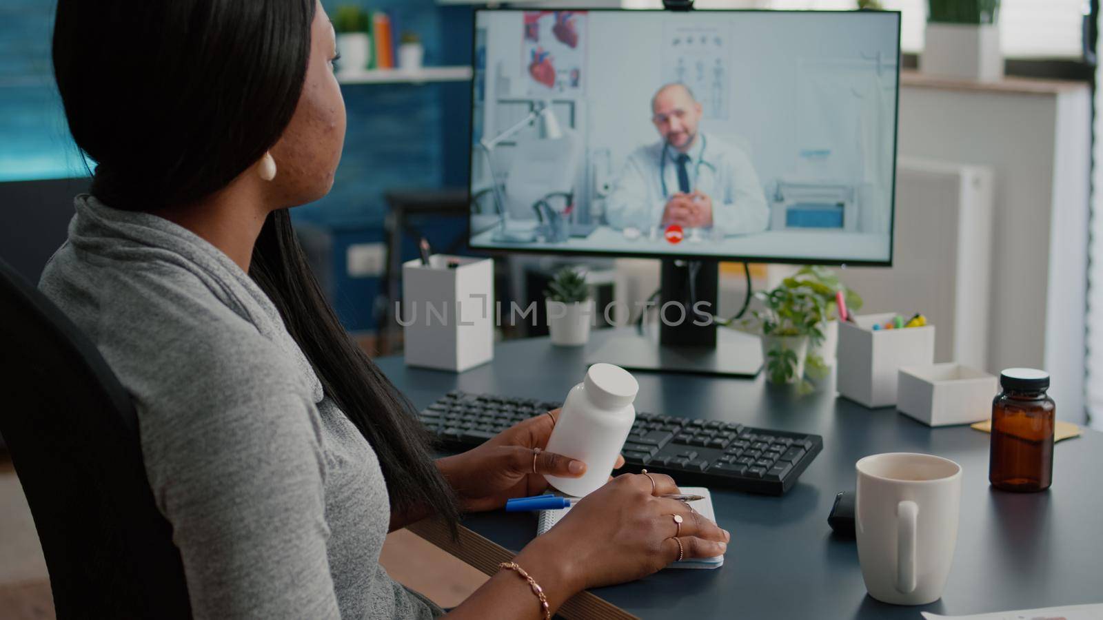 Sick woman patient discussing pills treatment for respiratory sickness with therapist during healthcare videocall conference meeting. Physician having online appointment explaining illness symptoms