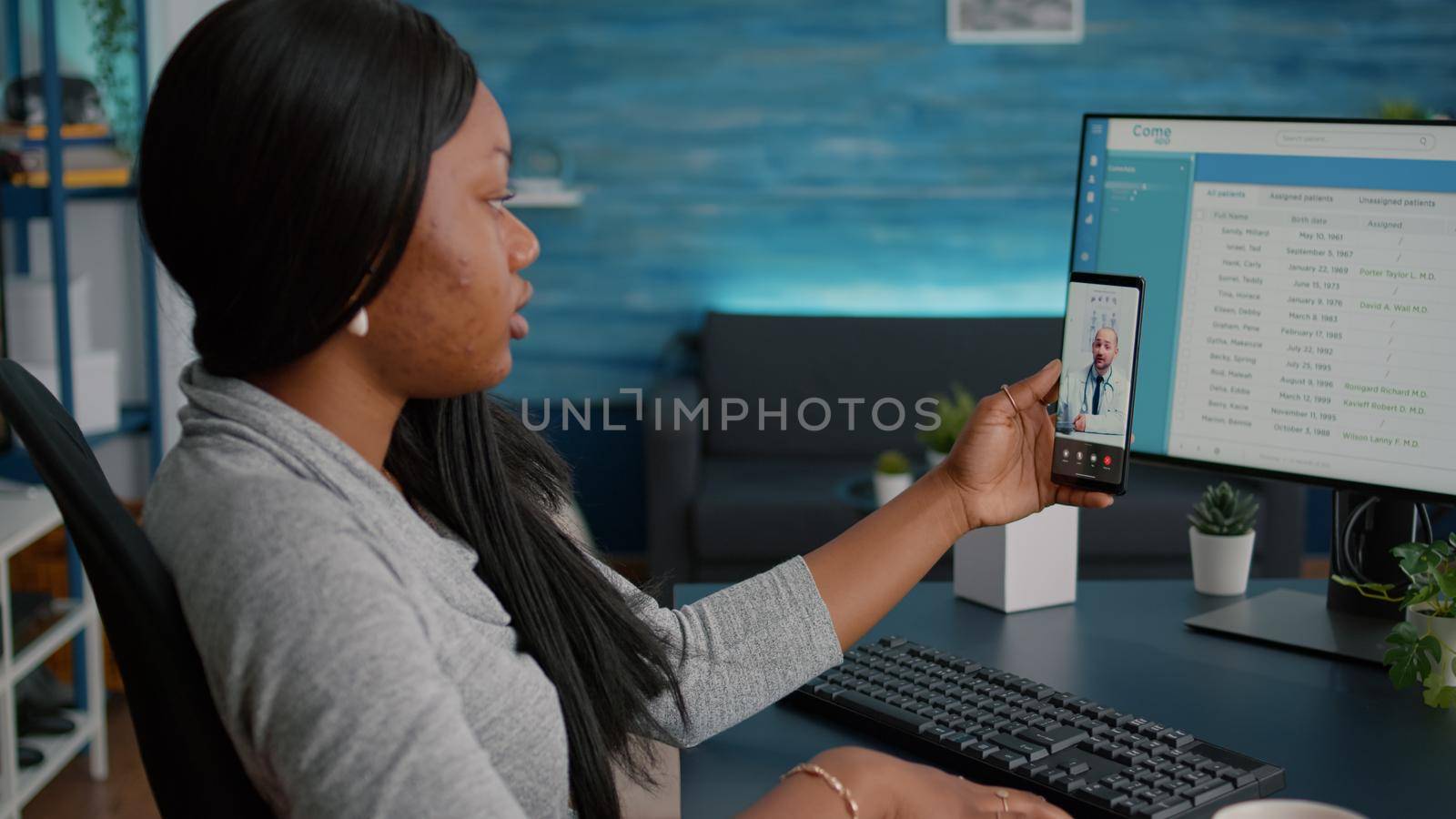 Student holding phone in hands during virtual healthcare telemedicine conference with physician doctor discussing respiratory sickness explaining illness treatment. Woman having online appointment