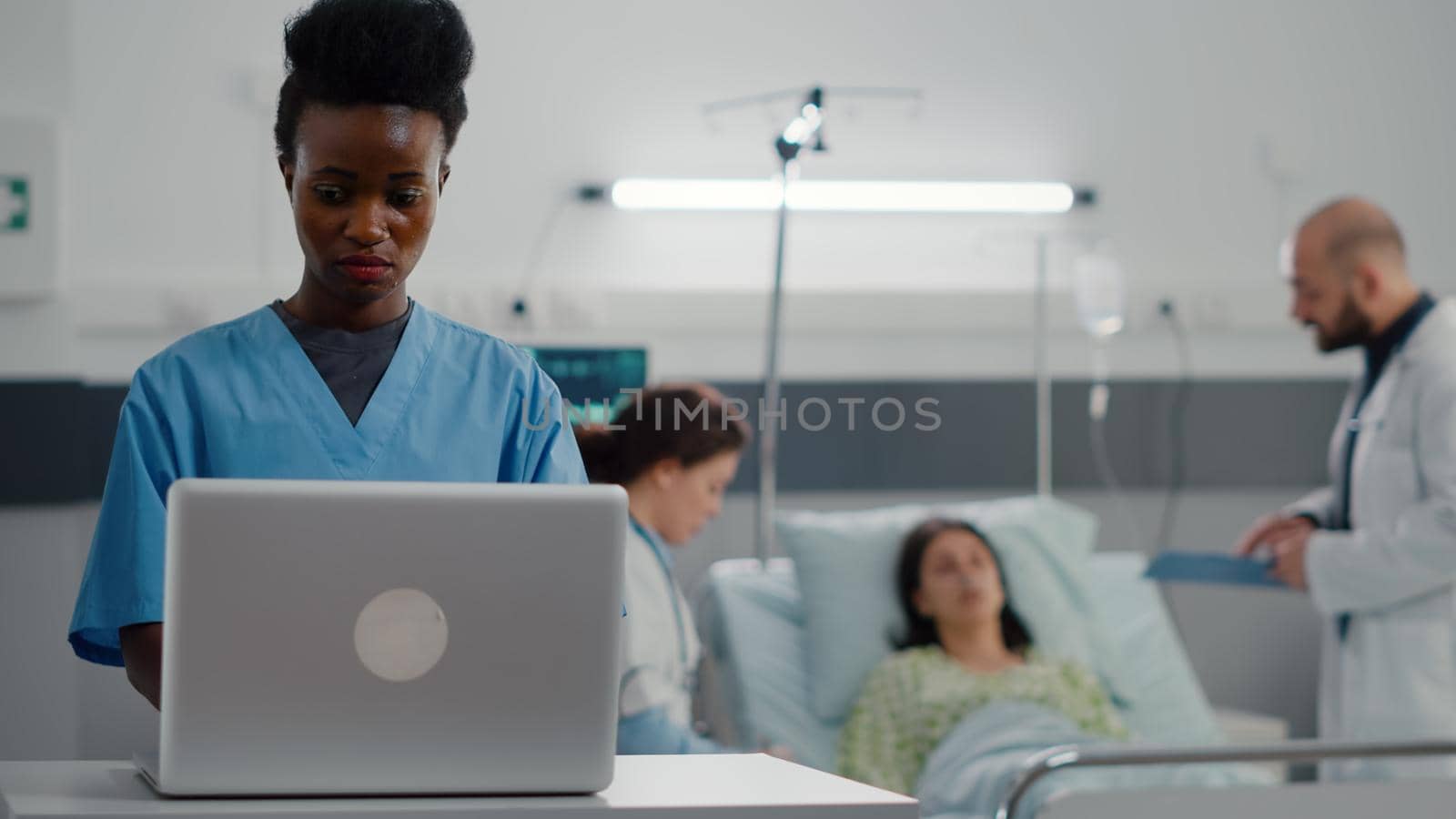 Afro american assistant typing sickness symptom on computer by DCStudio