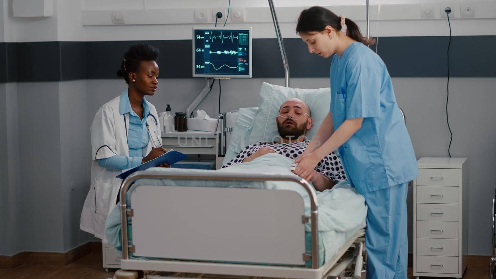 Sick man sitting in bed with oxygen tube explaining disease symptom by DCStudio
