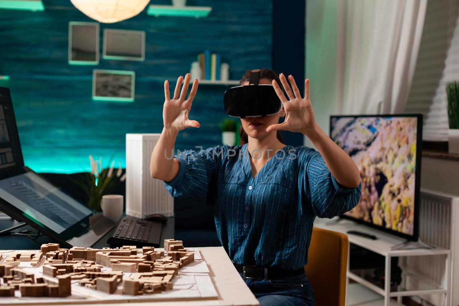 Professional architect using vr glasses for building vision hologram on 3d interactive technology at office workplace. Construction engineer woman designing creative digital simulation