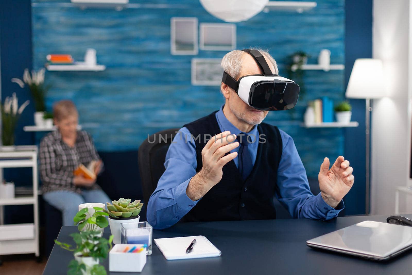 Happy pensioner experiencing virtual reality by DCStudio
