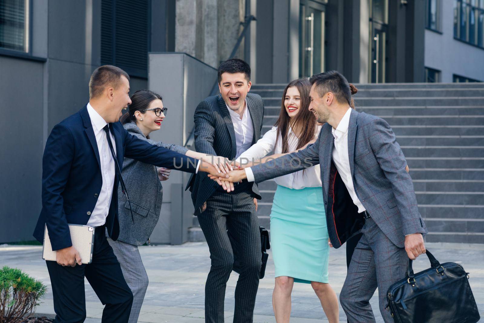 Happy Leader Motivate Diverse Employees Business Team Give Five Together, Office Workers Group and Coach Engaged in Team Building Celebrate Success Good Results Reward in Teamwork Concept. by uflypro