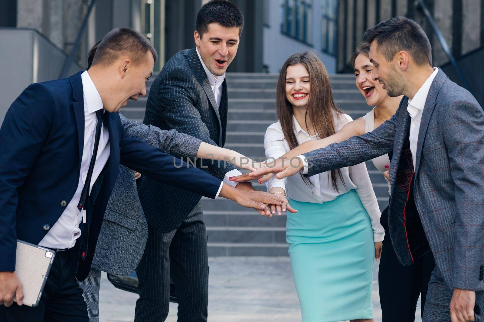 Happy Leader Motivate Diverse Employees Business Team Give Five Together, Office Workers Group and Coach Engaged in Team Building Celebrate Success Good Results Reward in Teamwork Concept. by uflypro