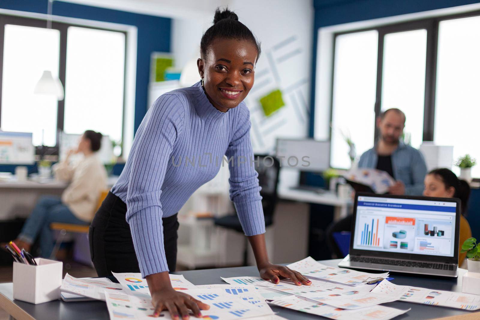 Portrait of black woman african manager entrepreneur smiling at camera by DCStudio