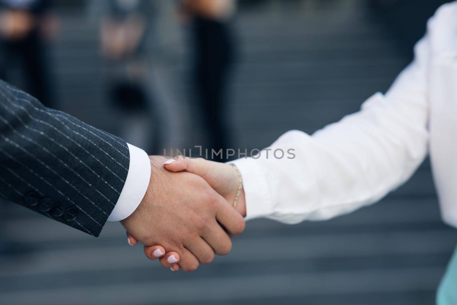 Close up Business People Shaking Hands Corporate Partnership Deal Welcoming Opportunity for Cooperation. Handshake of two people. Successful deal concept