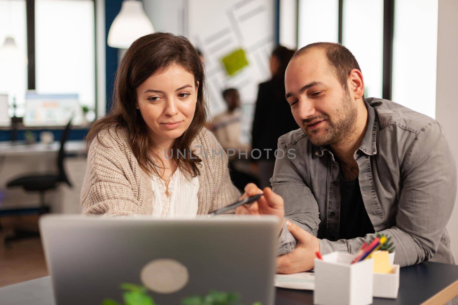 Business people discussing about financial problems by DCStudio