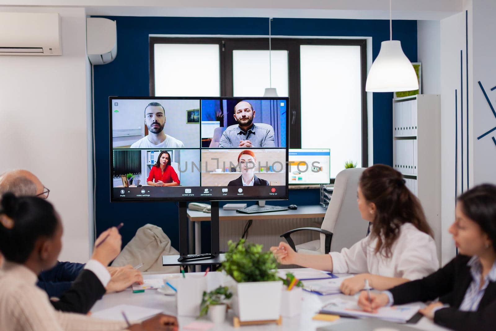 Team working by group video call share ideas brainstorming negotiating use video conference. Business people talking to webcam, do online conference participate internet brainstorming, distance office discussion.