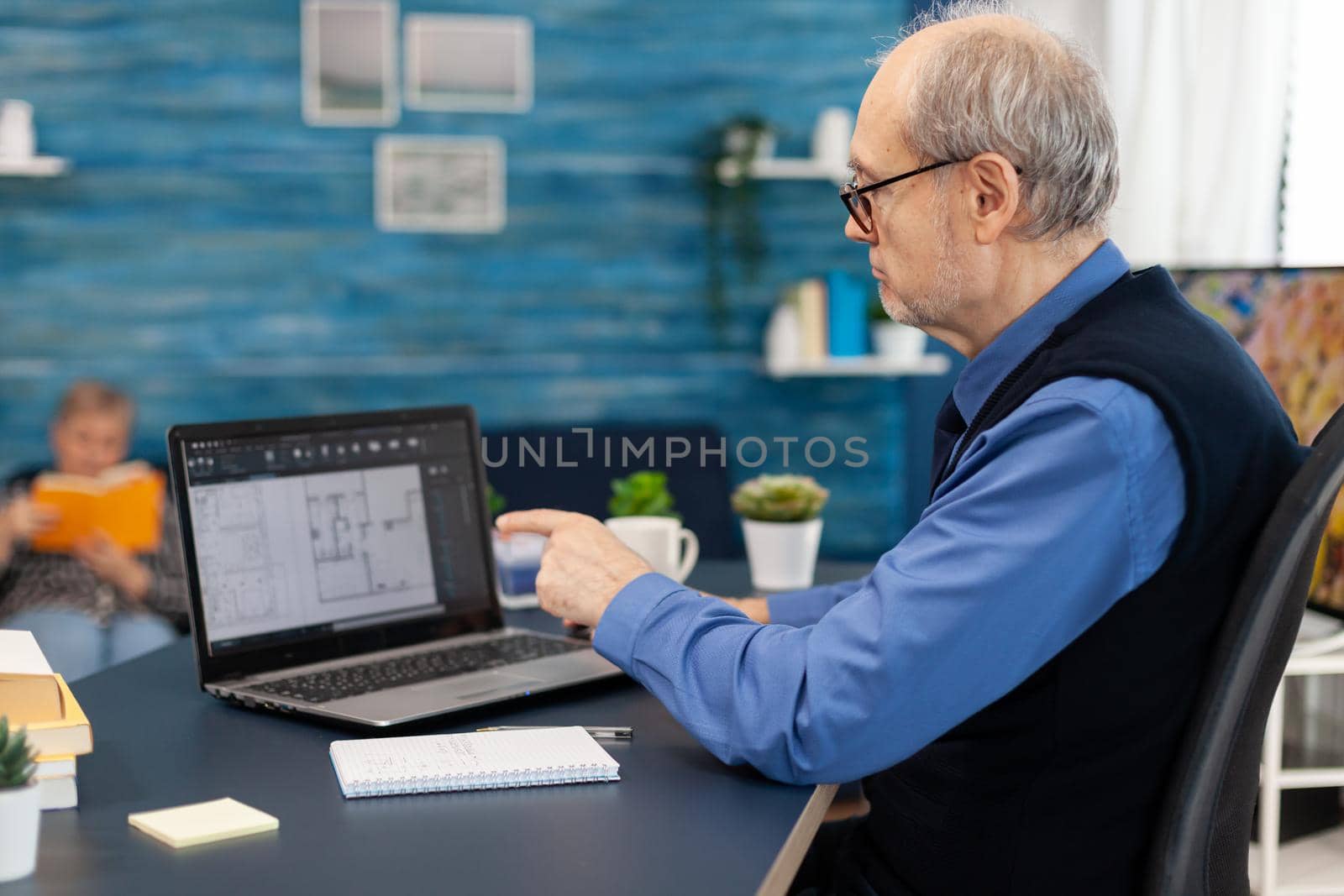 Senior man working with laptop by DCStudio