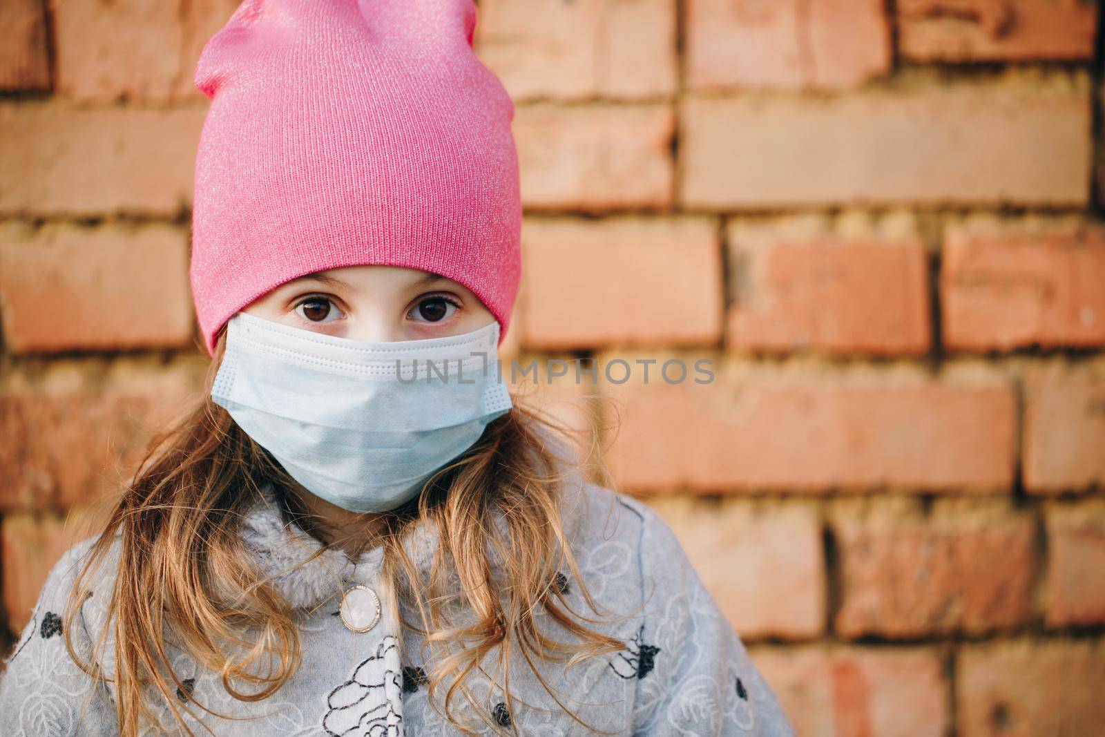 Closeup Of Beautiful Girl Wearing Medical Mask During Coronavirus COVID-19 Epidemic. Concept of health and safety life, N1H1 coronavirus, virus protection.