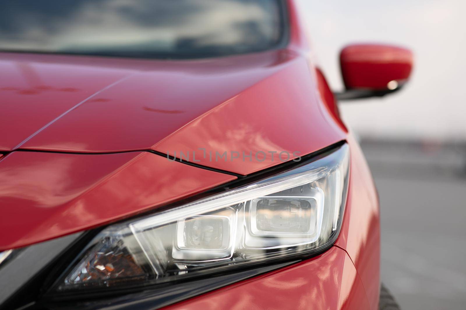 Car with headlight flashing smoothly close up. Car led light with a blurry background and a nice colour