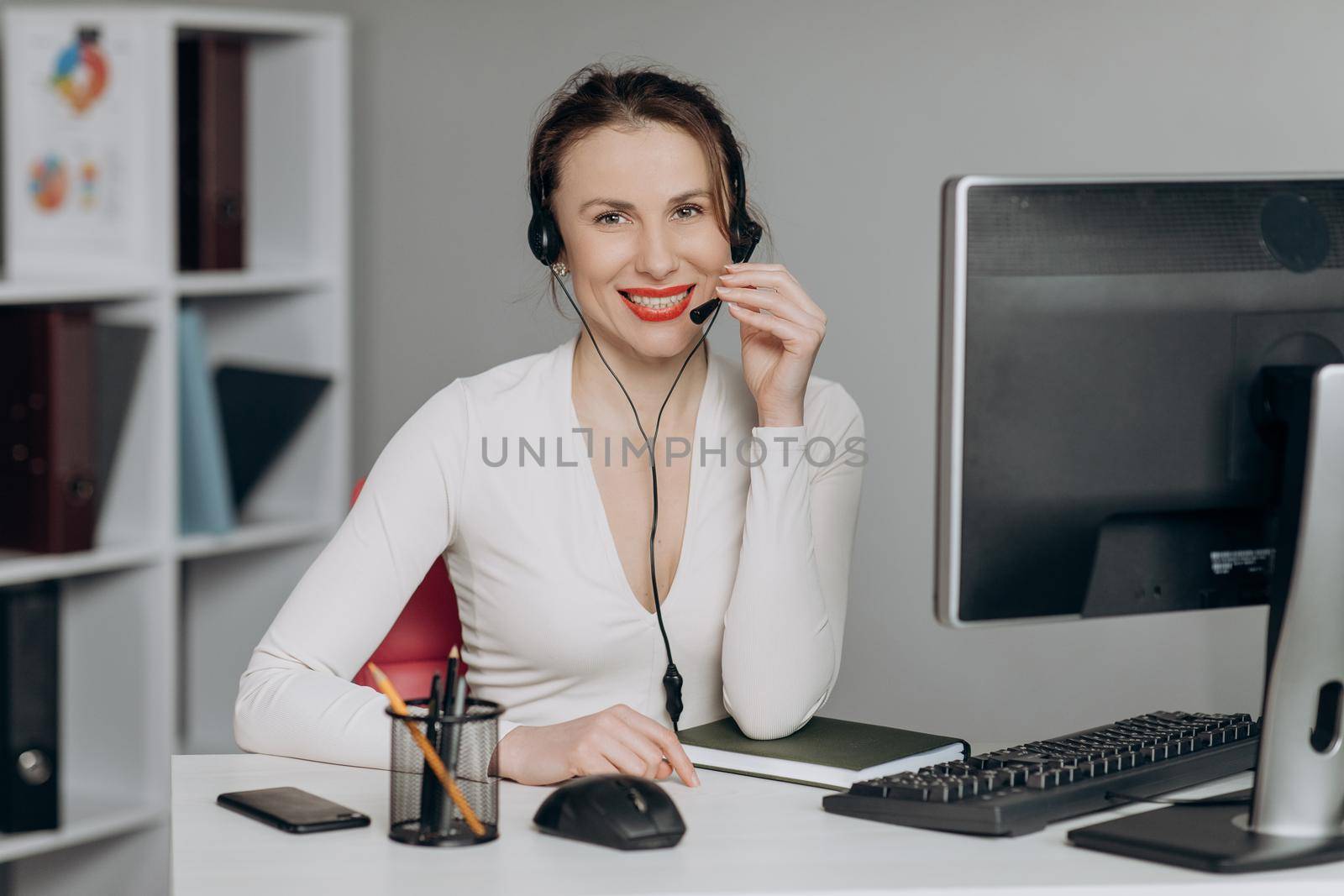 Support and Operator Service Business Representative Concept. Young Beautiful Women Call Center Wear Headset and Working with Computer while Consulting Customer with Online Problem.