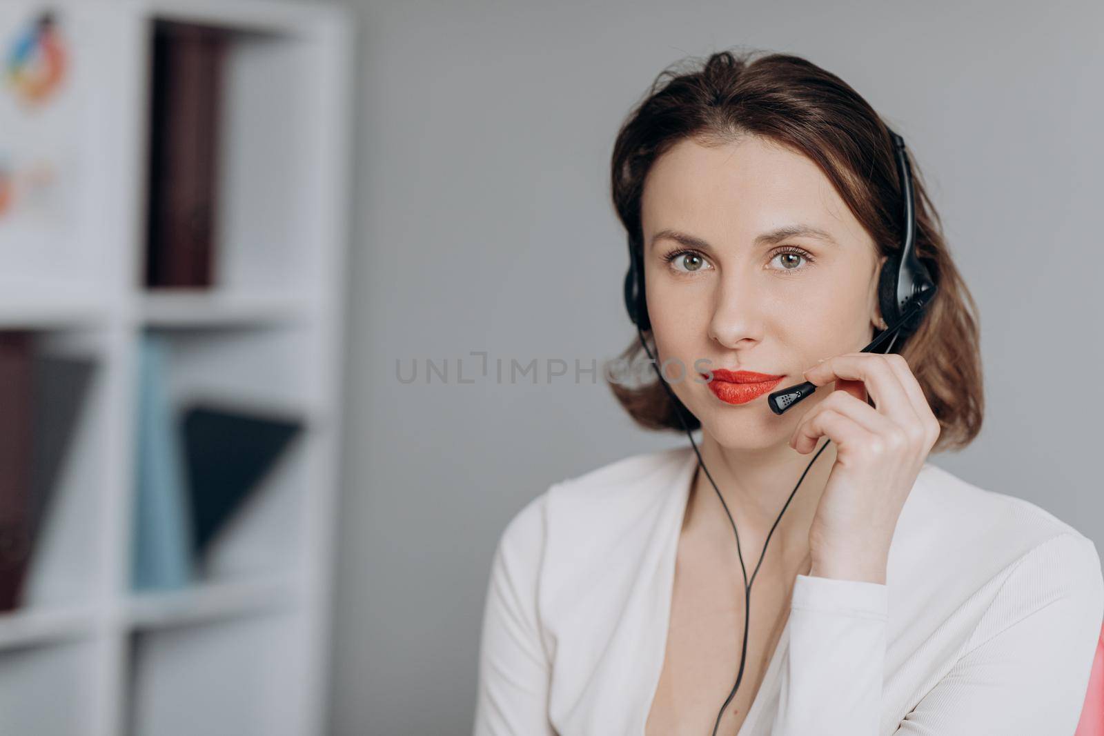 Young Beautiful Women Call Center Wear Headset and Working with Computer while Consulting Customer with Online Problem. Support and Operator Service Business Representative Concept. Online marketing.
