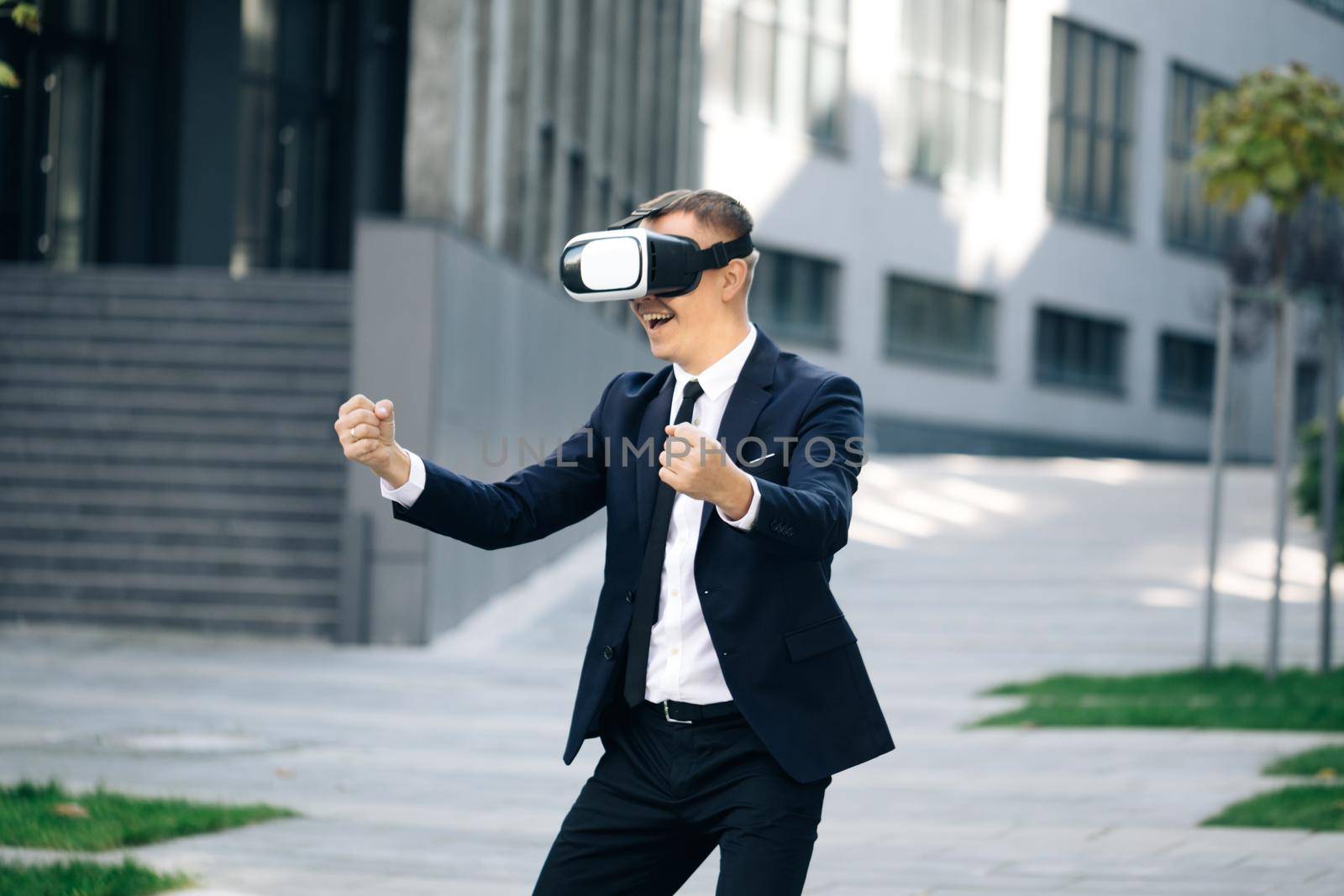 Man playing racing games using vr headset. Cheerful young gamer in virtual reality goggles is expressing excitement while enjoying car racing video game. Man wearing VR glasses watch Driver POV. by uflypro