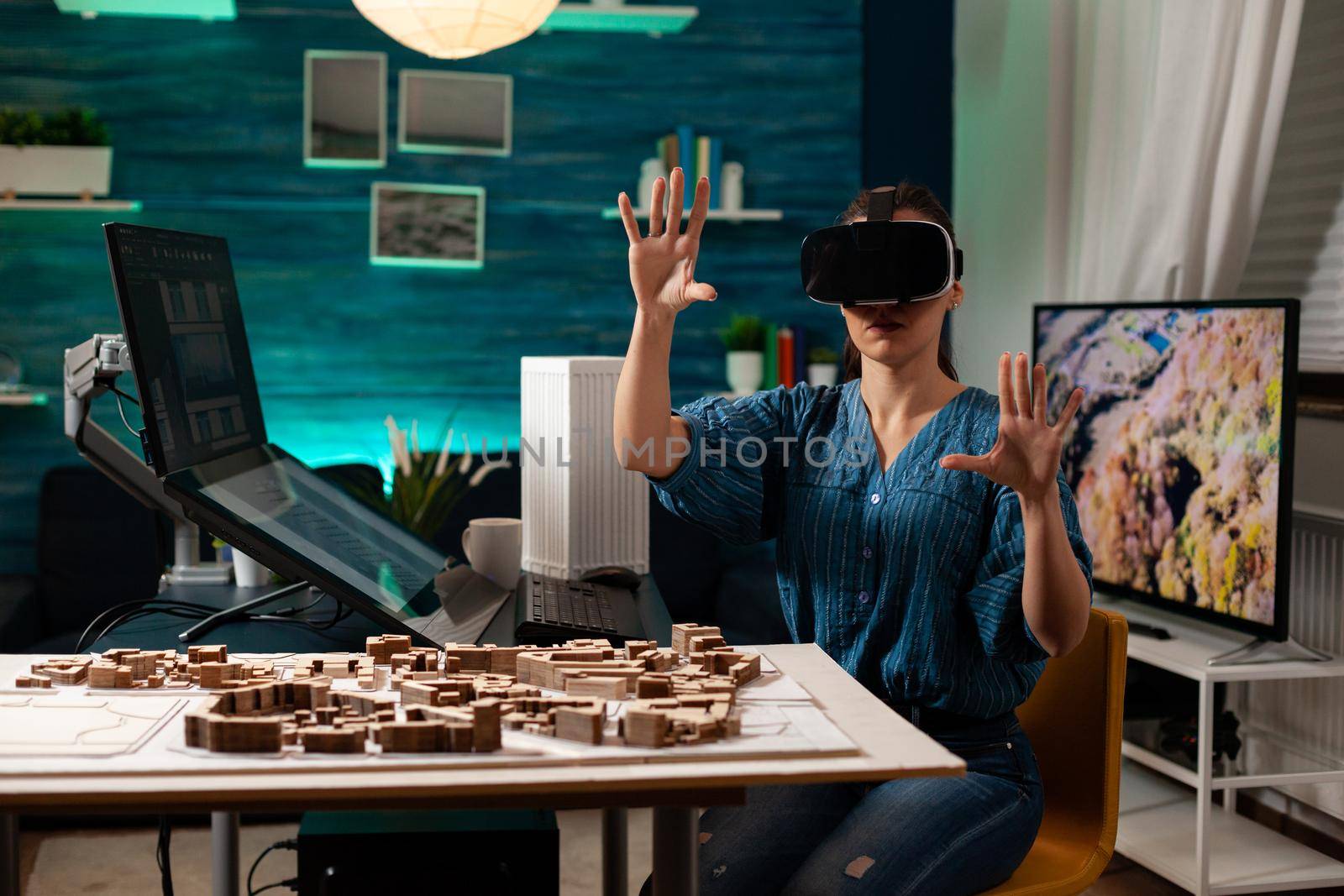 Modern business woman with vr glasses for innovation development vision using interactive software. Virtual designer working on holographic simulation experience for building model