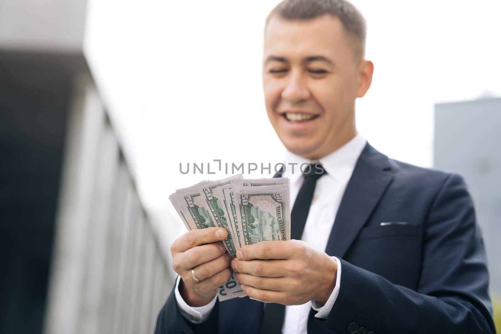 World economic crisis. Businessman Counting Money Usd Bills Payday. Total unemployment in a pandemic. Bribe. Dirty money. Successful business. Symbol of success, gain, victory.