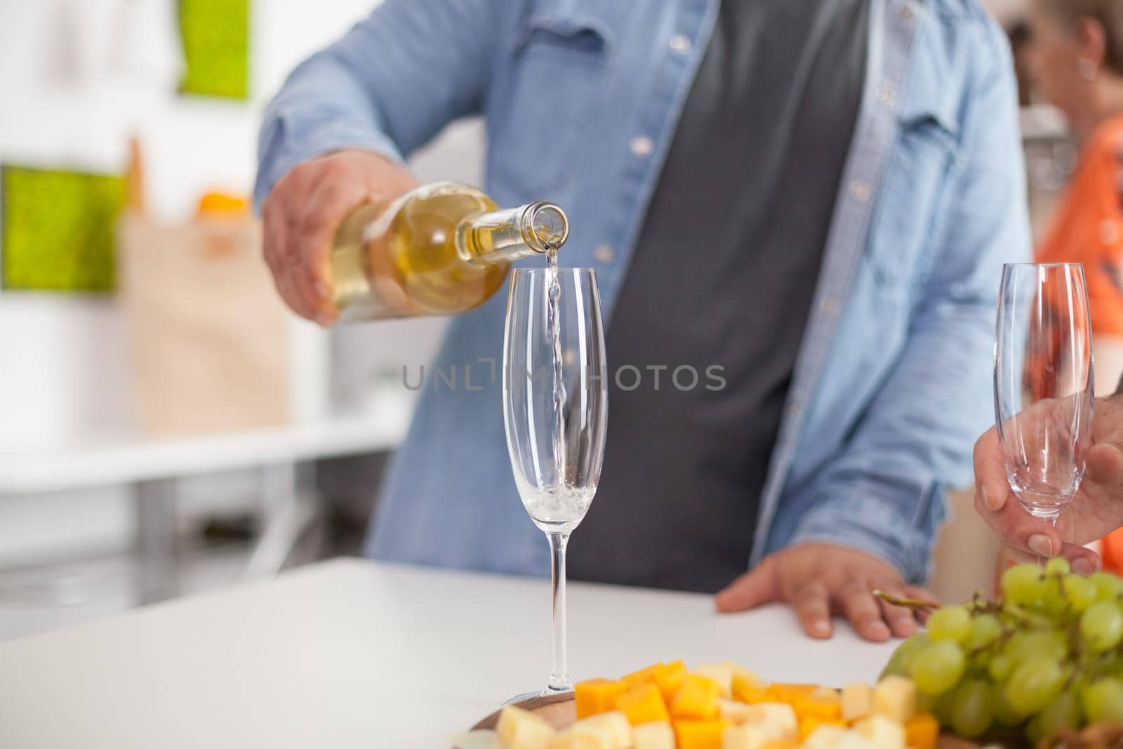 Man pouring cold wine by DCStudio