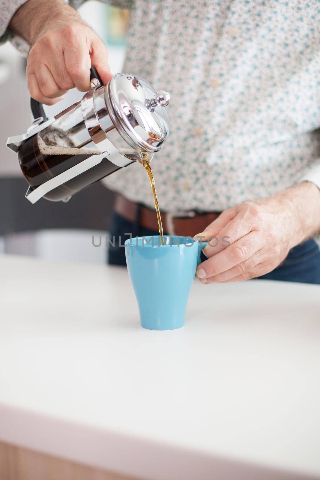 Close up of steaming mug of fresh coffee. Elderly person in the morning enjoying fresh brown cafe espresso cup caffeine from vintage mug, filter relax refreshment