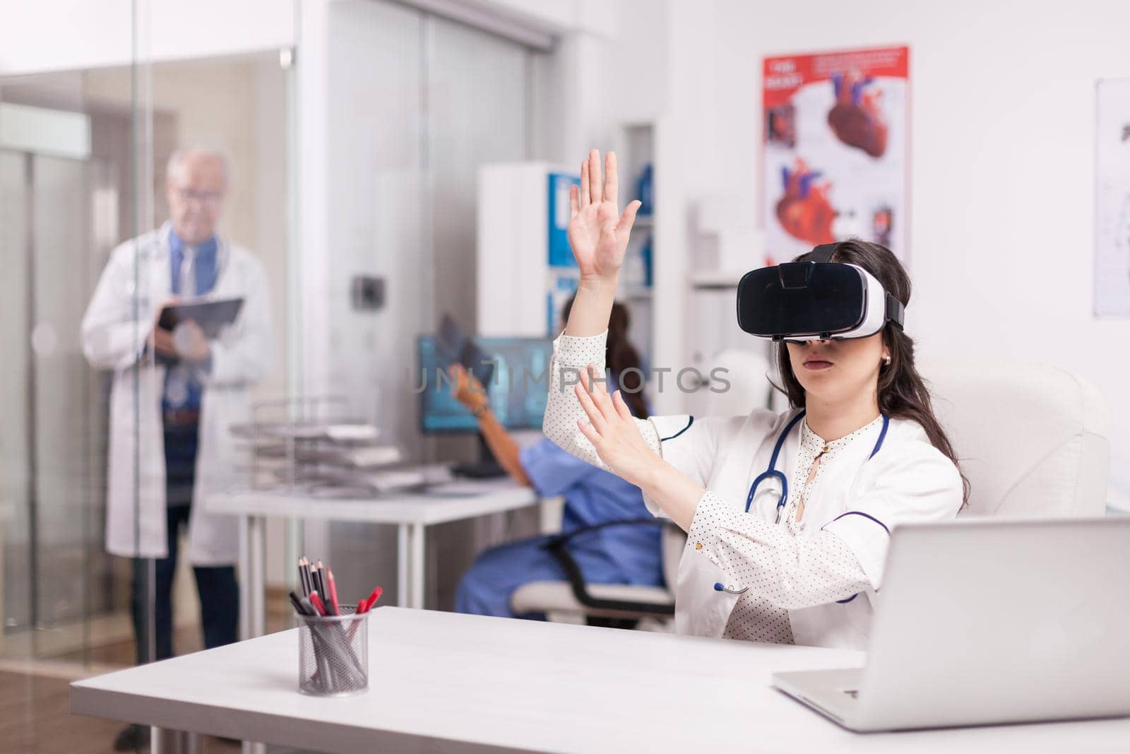 Doctor wearing high tech virtual reality goggles by DCStudio