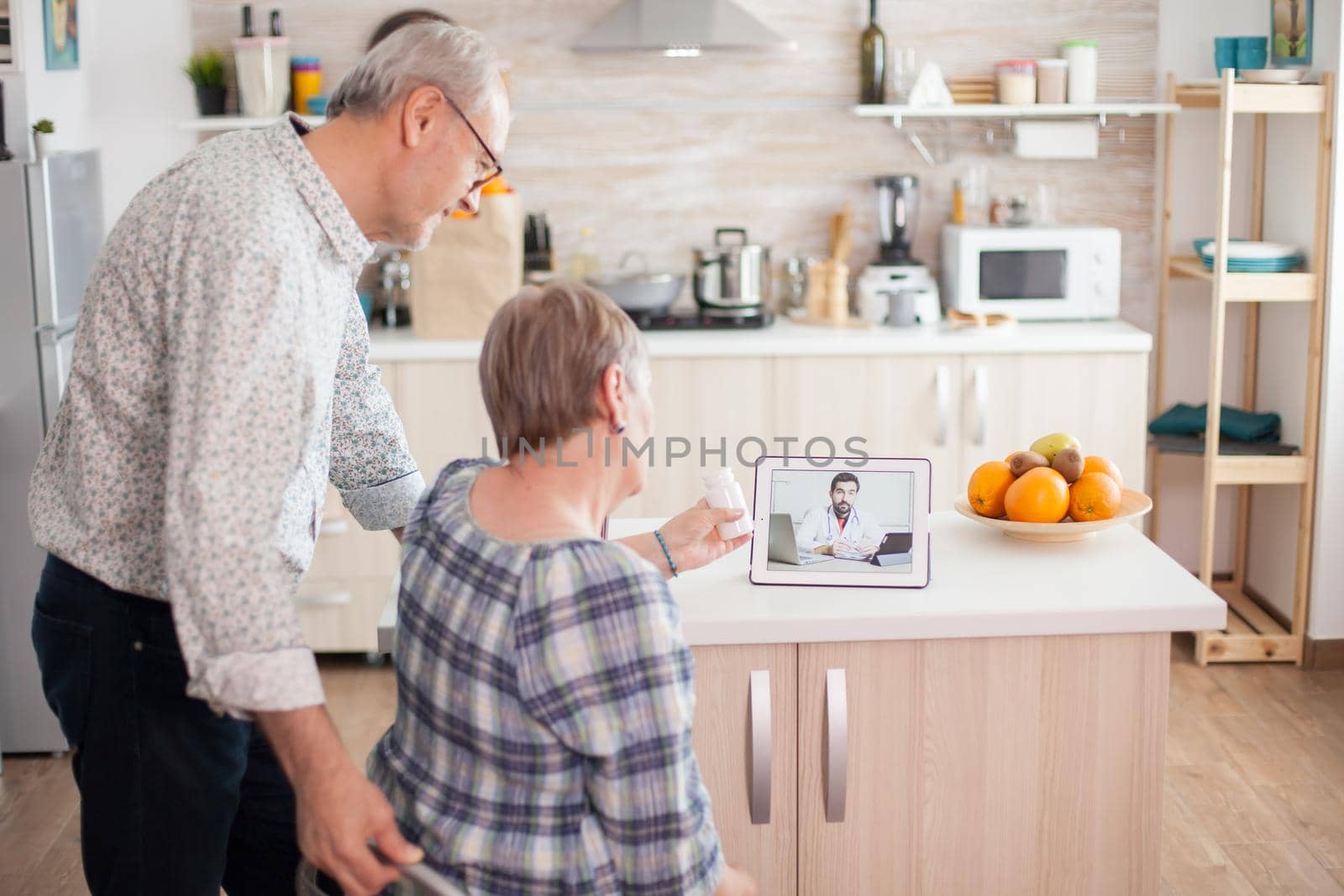 Senior couple listening doctor by DCStudio