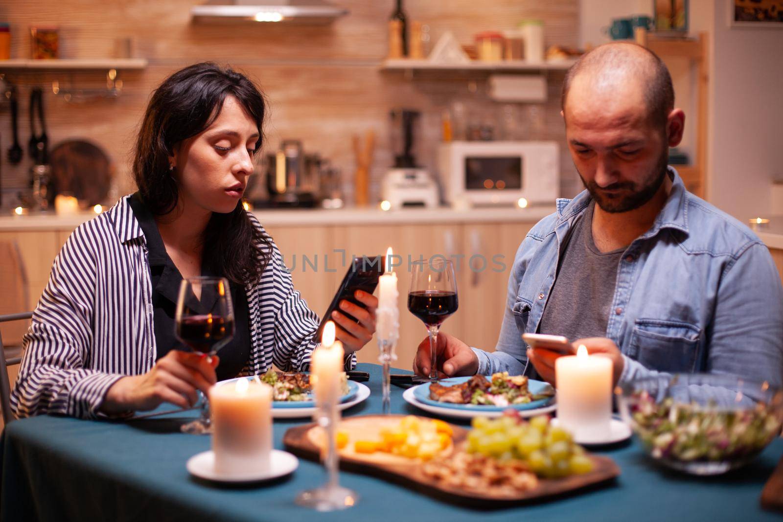 Dining using smartphone by DCStudio