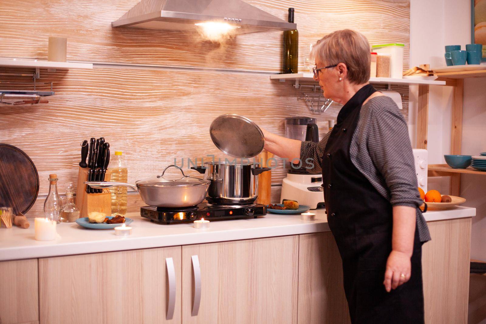 Checking food on gas cooker by DCStudio