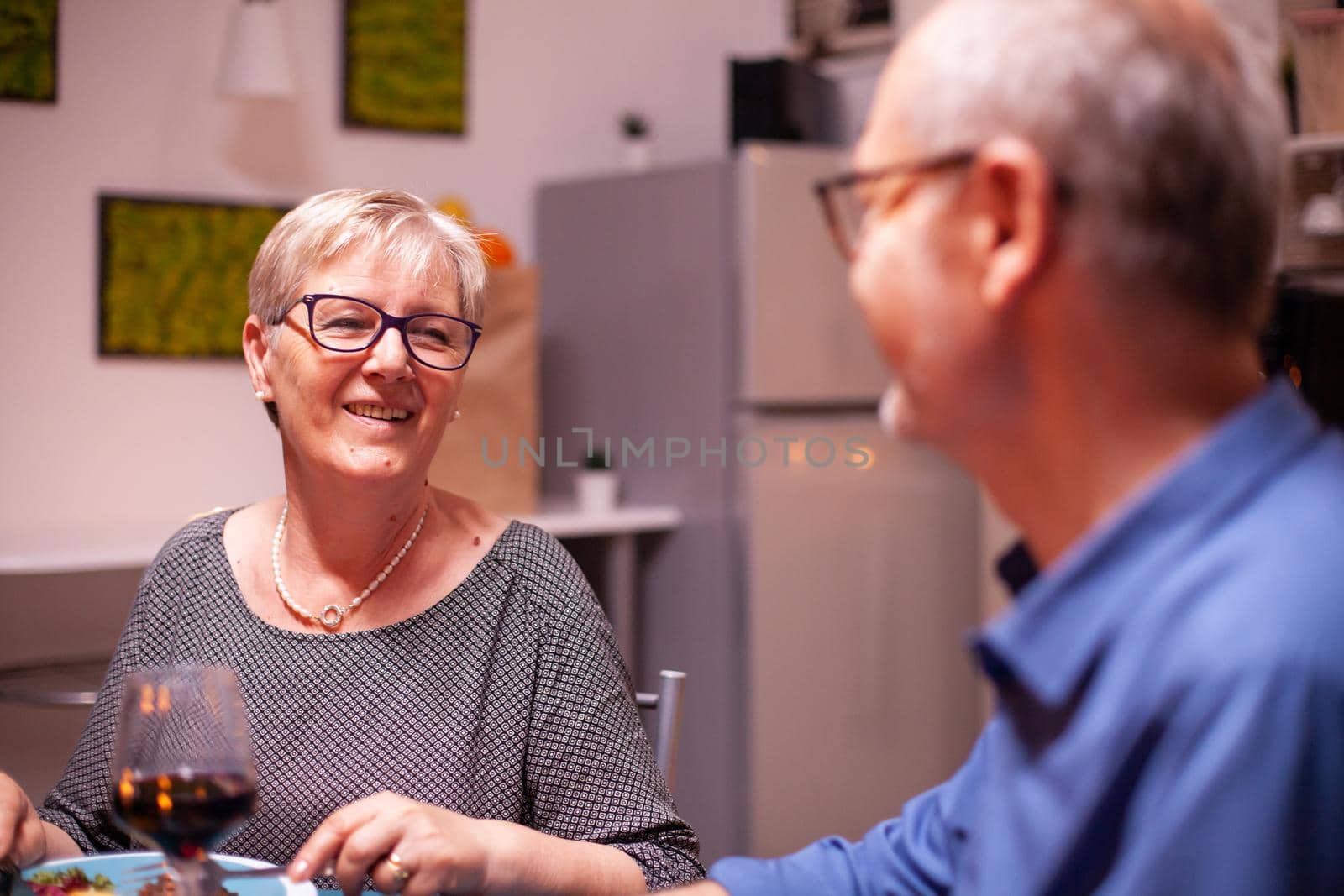 Elderly woman wearing glasses by DCStudio