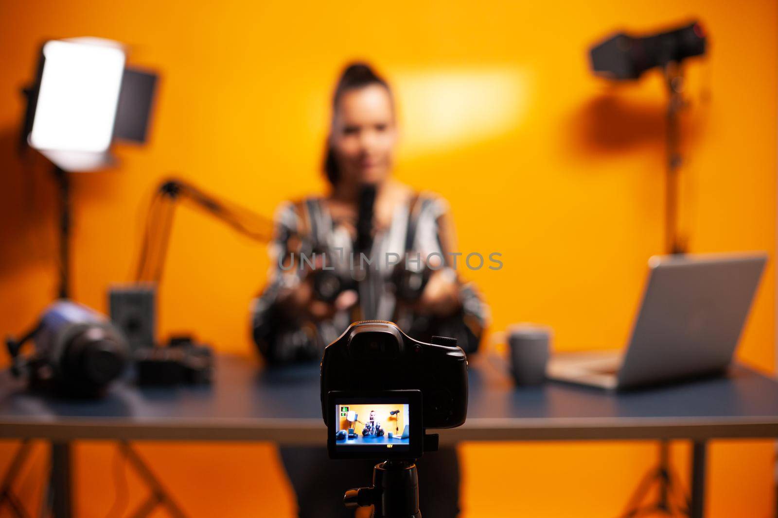Professional camera recording vlog of famous blogger. New media star influencer on social media talking video photo equipment for online internet web show.