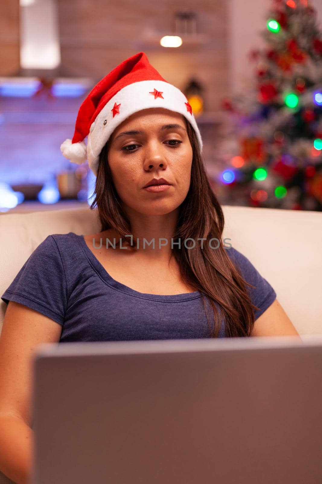 Girl looking at laptop screen reading business email by DCStudio