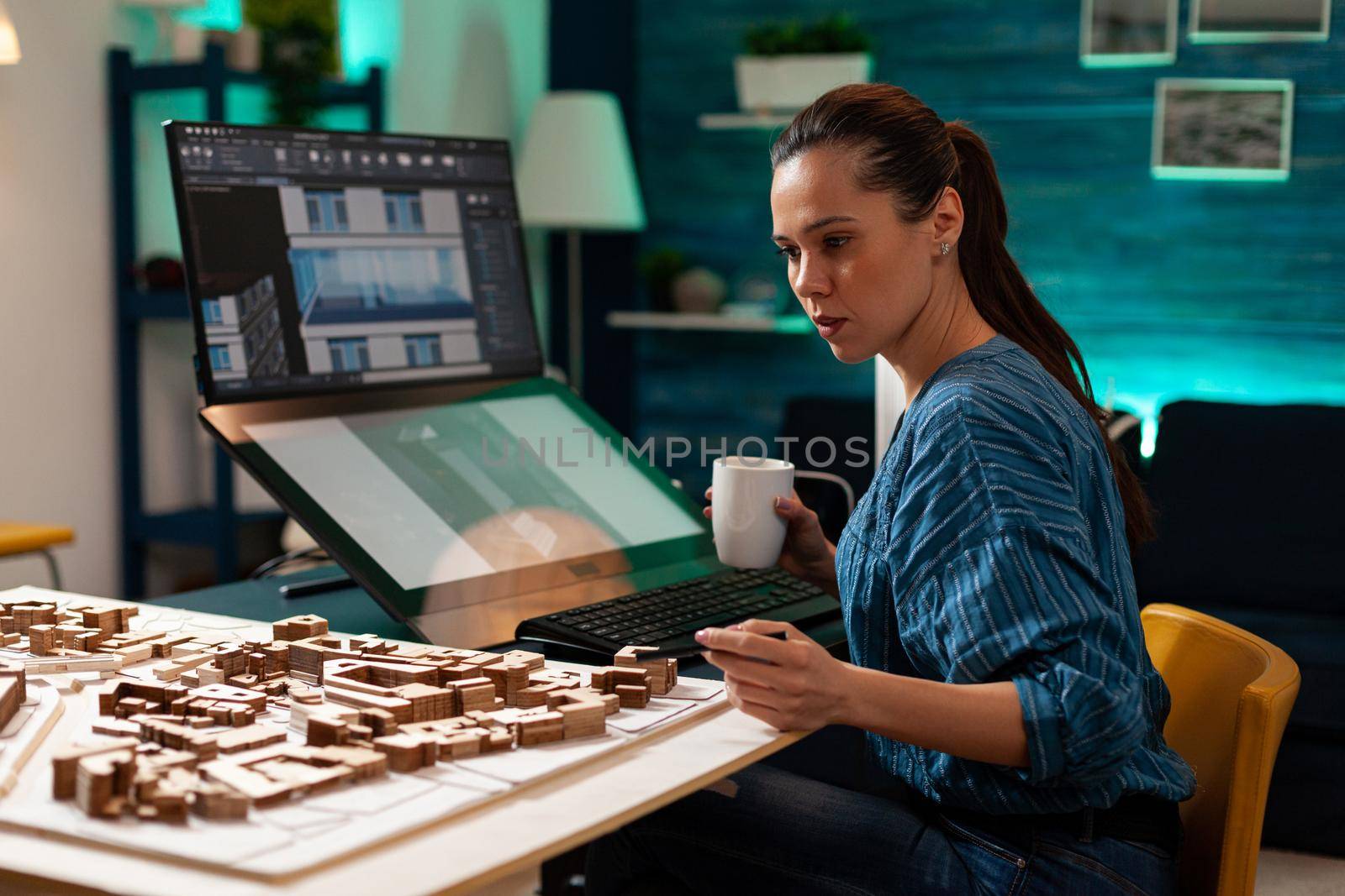 Woman with architect occupation working on blueprint by DCStudio