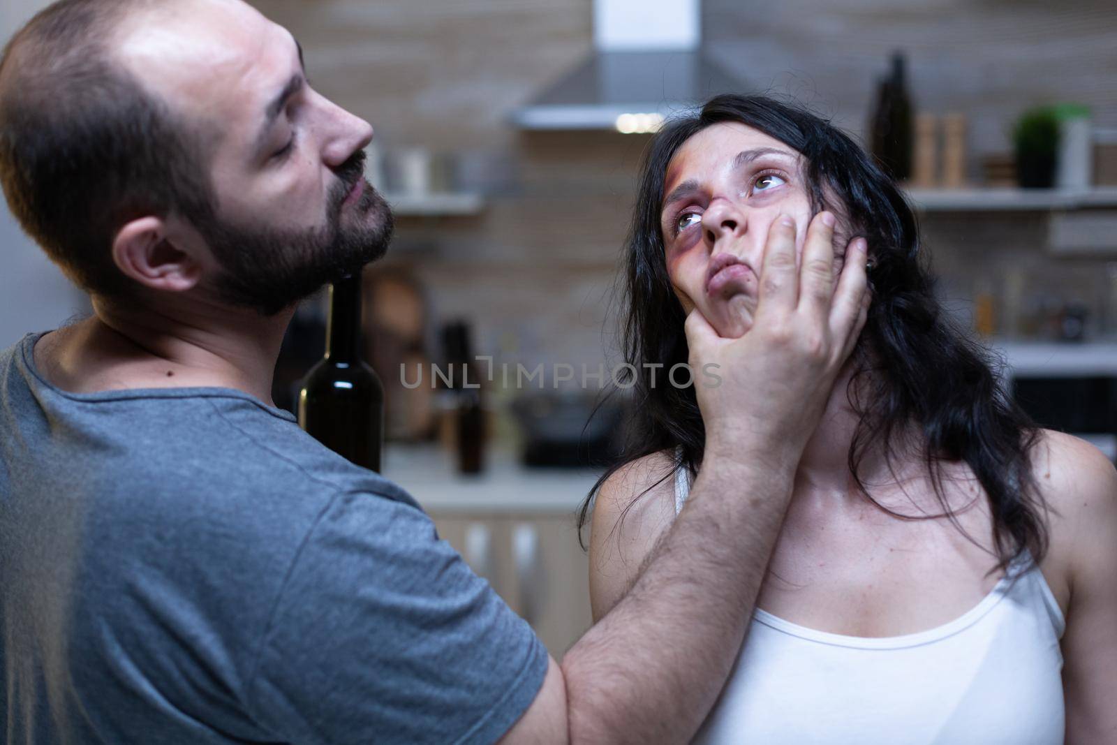 Angry husband getting physical with abused wife by DCStudio